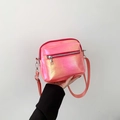 Iridescent pink crossbody bag featuring pearlescent texture and dual zipper pockets - Gradient Pink