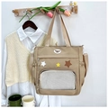 Details der khakifarbenen Segeltuch-Tasche mit Sternmuster, Netztasche und Schultergurt - Khaki