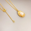 French style 18K gold-plated necklace with a natural freshwater pearl and bean pendant - Gold