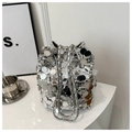 Detail of silver sequin bucket bag featuring a polished metal chain strap and reflective finish - Silver
