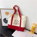 Contrast canvas tote bag with red and white paneling and RUN ALONE print for women - Red