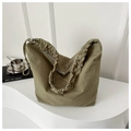 Olive green ruched canvas tote bag with pleated straps in a minimalist indoor setting - Green