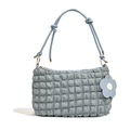Blue bubble textured tote bag with knotted shoulder strap and floral charm on white back - Blue