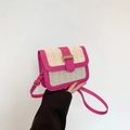 Straw-woven crossbody bag in pink and beige with golden H-buckle on white background - Rose Red