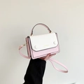 Pink and white contrast square crossbody bag with gold text and top handle detail - Pink
