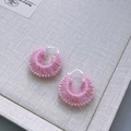 Close-up of pink handmade yarn wrapped hoop earrings with silver metal clasps - Pink Candy