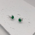 Macro detail of round green agate studs with textured silver plating and gear edges - Green Agate