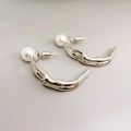 Minimalist silver earrings with abstract human figure and round white pearl inlays - White Gold