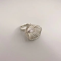 Modern silver open ring with unique hollow cage design and a bright clear gemstone - White Gold