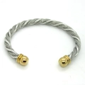 Two-tone twisted cable wire cuff bracelet with gold-tone spherical end caps - Gold/Steel