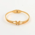 Gold butterfly bangle in matte finish with sparkling zircon accents and spring clasp - Gold Single Butterfly with Zircon (BR8256)