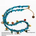 Collana bohémien in pietra naturale blu con ciondoli a cuore dorati e zirconi colorati - Collana
