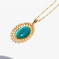 Collana vintage dorata con ciondolo ovale in occhio di gatto verde e piccoli zirconi - Blu