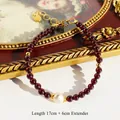 Bracciale artigianale di granato con perla barocca e catena in oro, lungo 17+6cm - Bracciale