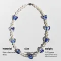 Blue glazed heart pendant necklace with white pearls and vintage brass components - Necklace