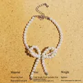 Eleganter Perlen-Schleifen-Armband aus Messing mit Goldbeschichtung und Verlängerungskette - Armband