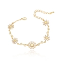 Elegant gold flower bracelet with emerald daisy links and white zircon petals on white background - Gold Metal with Yellow Rhinestone