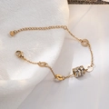 Pulsera minimalista de acero de titanio dorado con cilindro de circonita y números romanos - Estilo de Circonia Cilíndrica Dorada (TS0009)