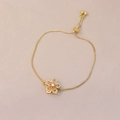 Detail of adjustable gold flower bracelet with pink zircon petals and box chain - Pink