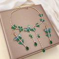 Elegant gold necklace and earring set featuring emerald green zircon in vine design - Green Blue Gemstone Vine Style (PJ-12) / Gold