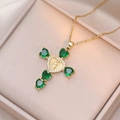 Detail of gold cross pendant with green heart-shaped zircon and Mary relief - Gold with Emerald Zirconia (X2697)