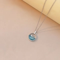 Minimalist whale pendant necklace with ocean blue resin wave on a silver chain - Whale Style