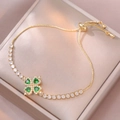 Golden clover bracelet with green heart-shaped gemstones and white cubic zirconia accents - Emerald Heart Bracelet (TS0127)
