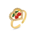 Macro view of adjustable gold ring with heart-shaped zircon frame and red cherry motif - Heart Base Cherry Style (J0980)