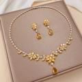 Elegant gold-tone flower jewelry set with yellow zircon pendants on champagne tray - Yellow Flower Cluster (PJ-158)