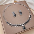 Elegant jewelry set with black teardrop gemstones and cubic zirconia necklace and earrings - Black Oval (PJ-105)
