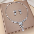 Detailed macro view of ziconia floral necklace and teardrop earrings set on a silk base - Multi-layer Clear Floral (PJ-147)
