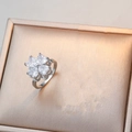 Polished silver clover ring with four heart-shaped zircons on rose gold textured jewelry box - Silver Ring (J0427-戒指-2)