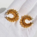 Golden spiral hoop earrings with elegant 3D spring twist design shown in detail - Gold