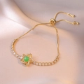Detail of adjustable gold box chain bracelet with green gemstone and floral zircon setting - Gold Emerald Hollow Flower Style (TS0206)
