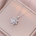 Rotating heart flower necklace with cubic zirconia pendant in silver finish - Steel Rotating Flower Necklace