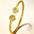 Detailed shot of gold titanium bracelet featuring Roman numerals and clear crystals - Gold Roman Numeral Rhinestone Style