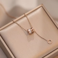 Rose gold Roman waist necklace with tassels and crystals on champagne jewelry box - Cylinder Studded / Rose Gold
