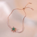 Adjustable snowflake bracelet in rose gold with green and white cubic zirconia stones - Rose Gold Snowflake with Green Gemstone Style (TS0084)