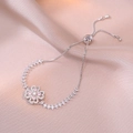 Adjustable silver bracelet featuring a rotating pink zircon flower on satin fabric - Silver Rotating Pink Zirconia Flower Style (TS0186)