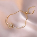 Elegant gold-finished rotatable clover bracelet with white zircons on pink silk - Gold Rotating Clover Style (TS0198)