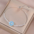 Adjustable silver bracelet with sparkling zircon stones and a blue daisy charm pendant - Silver Light Blue Daisy Style (TS0278-2)