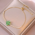 Bracciale dorato regolabile con ciondolo a fiore verde e lucenti zirconi cubici - Fiore Verde Oro (TS0292) / Verde