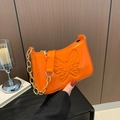 Vibrant orange patent leather shoulder bag with butterfly embossing and gold chain - Orange