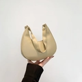 Beige crescent underarm bag in premium faux leather with elegant curved silhouette - Khaki