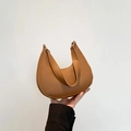 Chic caramel brown leather hobo bag featuring wide shoulder strap and gold hardware - Brown