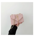 Pink quilted chain crossbody bag with golden SS logo and elegant tassel detail - Pink