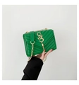 Chic green quilted crossbody bag with golden chain strap and fringe charm detail - Green