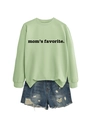 Detail of mom's favorite lettering on light green sweatshirt with distressed denim shorts - Olive Green Sweatshirt (Black Font)