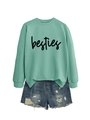 Detail of mint green sweatshirt with besties script text and ripped denim shorts - S / Sweatshirt And Shorts / Light Green (Black Text)