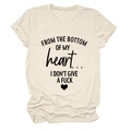 Detail of cotton t-shirt fabric with heart graphic and artistic letter printing - Sand (Black Font)